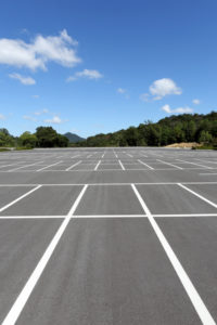 Signs Your Commercial Concrete Parking Lot Needs Repair or Demolition