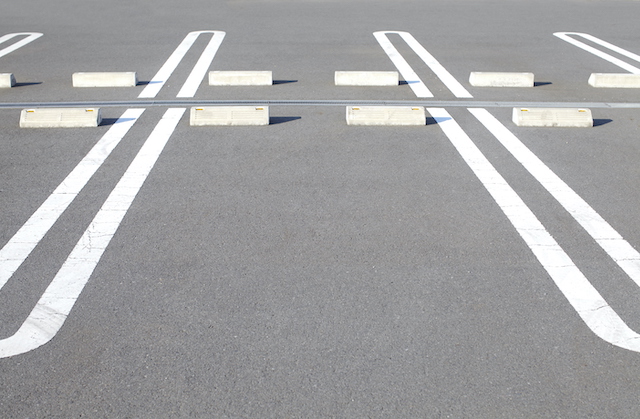 Top Warning Signs Your Commercial Parking Lot Needs Repairs or Demolition